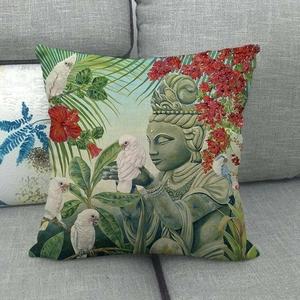 Detailed texture of linen cushion cover with Buddha, white parrots and tropical leaves