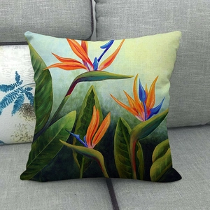 Close-up of watercolor bird of paradise floral pattern on linen blend pillowcase
