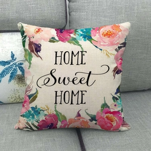Detail of floral wreath design and Home Sweet Home text on linen pillowcase