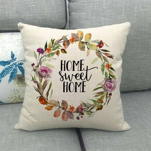 Close-up of Home Sweet Home floral wreath print on square linen blend cushion cover