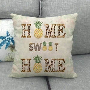 Close-up of linen pillowcase with Home Sweet Home text and pineapple detail