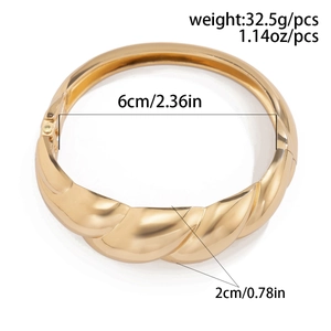 Detail showing dimensions of wide gold twisted cuff bracelet with 6cm inner diameter