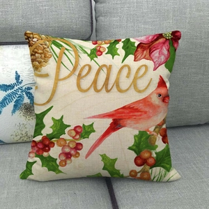 Détail de la taie d'oreiller de Noël en lin avec oiseaux rouges et texte Peace doré