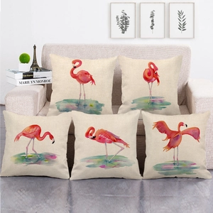Set of 5 flamingo watercolor print linen throw pillow covers on a gray sofa