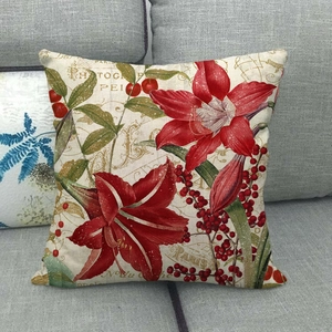 Détail de la texture du coussin en lin avec lys rouge et écriture française vintage