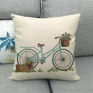 Detail of linen cushion cover with watercolor vintage bicycle and flower print