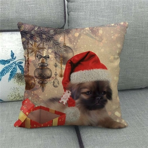 Detail of linen Christmas pillowcase featuring a festive dog in a red hat on a sofa