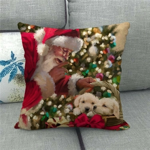 Close-up of linen pillow cover showing Santa Claus with puppies on a grey sofa
