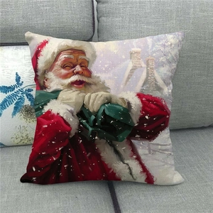 Detail of Christmas pillowcase with oil painting Santa Claus print on gray sofa