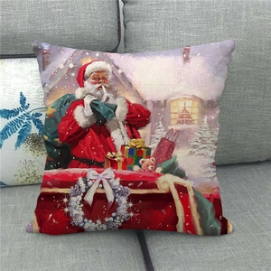 Close-up of linen Christmas pillowcase featuring Santa Claus on a grey sofa