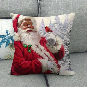 Detail of linen texture on Christmas pillow cover featuring Santa and red bird design