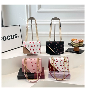 Detail of four patterned crossbody bags with gold chains and magnetic flap closures