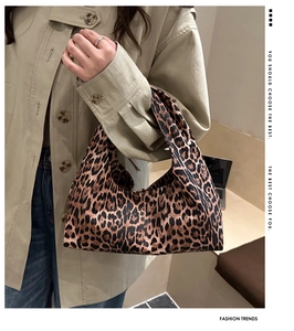 Detail of trendy leopard print tote bag with stylish canvas texture and soft structure
