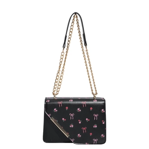 Black crossbody bag with pink floral and bow patterns featuring gold chain strap