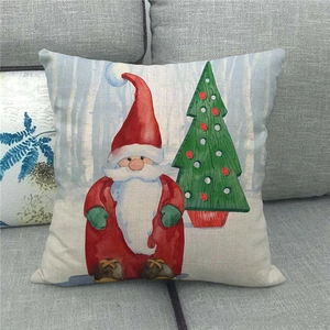 Close-up of linen pillowcase featuring watercolor Santa Claus and Christmas tree design