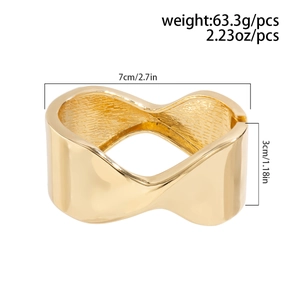 Bracciale rigido ondulato oro lucido con design geometrico Mobius da donna