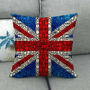 Linen Union Jack throw pillow with colorful polka dot pattern on a grey sofa