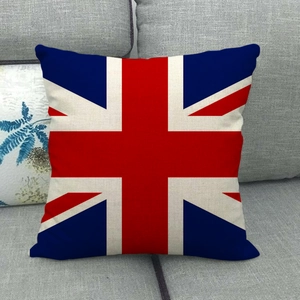 Detail of Union Jack linen pillow cover with vintage texture on a grey sofa
