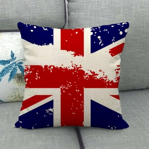 Detail of vintage Union Jack linen pillowcase featuring artistic distressed texture on sofa