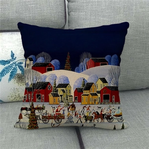 Detailed texture of linen Christmas pillow case with hand-drawn snow scene and red barn