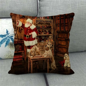 Detail of Christmas pillow cover with Santa and dogs oil painting style on gray sofa