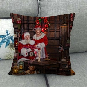 Detailed close-up of a festive linen pillow cover featuring a retro Santa oil painting