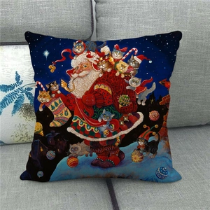 Linen Christmas pillow cover with Santa and cats on a gray sofa in detail