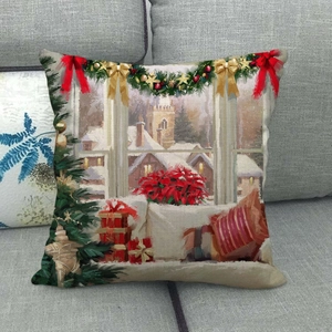 Detailed Christmas linen pillowcase showing oil painting style holiday window on a sofa