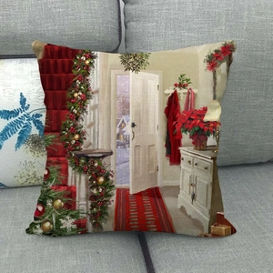 Christmas linen pillowcase with holiday scene illustration on a grey fabric sofa