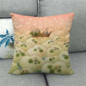 Detail of linen pillowcase featuring a cat in a boat amid artistic orange clouds