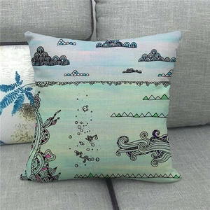 Close-up of linen pillowcase with colorful hot air balloon penguin illustration on grey sofa
