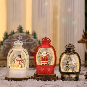 Set of three Christmas lanterns with LED lights, snowman and Santa Claus glitter globes