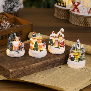 Set of 4 glowing resin Christmas miniature houses with Santa and snowman figurines