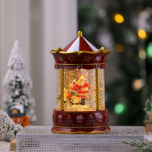 Detail of a musical Christmas carousel lantern with snow globe effect and Santa Claus figure