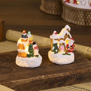 Lighted Christmas resin house miniatures with Santa and snowman festive ornaments