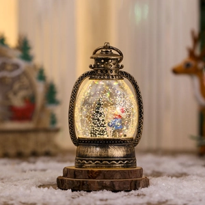 Detail of vintage Christmas lantern with internal snow globe scene and warm LED lighting