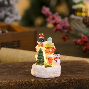 Glow-in-the-dark Christmas resin house with snowman and miniature tree decoration