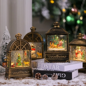Close-up of vintage Christmas lanterns with snow globe effect and warm LED lights