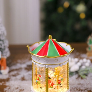 Detailed close-up of a Christmas carousel water globe with Santa and reindeer scene