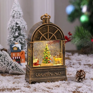 Close-up of vintage bronze Christmas lantern with deer, snow globe effect and warm LED light