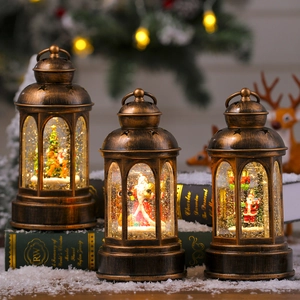 Trois lanternes de Noël vintage en bronze avec lumières LED et scènes festives