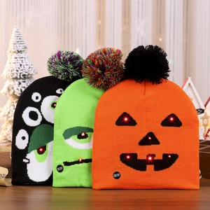 Three LED Halloween knit hats with skull, ghost and pumpkin patterns for party decor