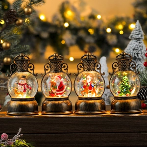 Set of four vintage bronze Christmas snow globe lanterns with warm LED lighting and music