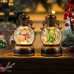 Retro Christmas lantern with glowing snowman and tree scenes on a wooden surface