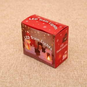 Close-up of red retail packaging box for LED train lights Christmas decorative ornament