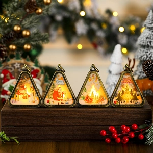 Macro shot of four vintage Christmas lanterns with LED lights and holiday scene prints