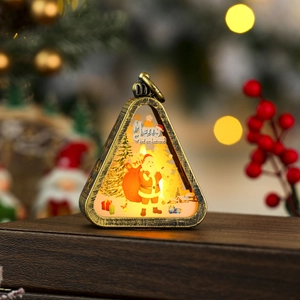Detail of vintage Christmas lantern featuring Santa pattern and warm LED glow decor
