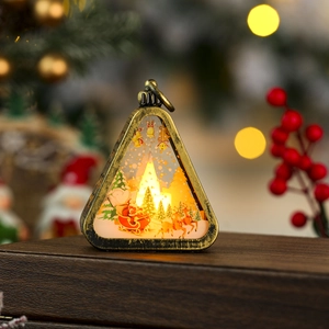 Close-up of vintage bronze Christmas lantern with LED light and Santa deer pattern