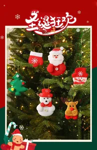 Close-up of felt Christmas tree ornaments with snowman and reindeer hanging on tree