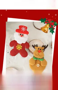 Detail of handcrafted felt Santa Claus and reindeer Christmas tree hanging ornaments